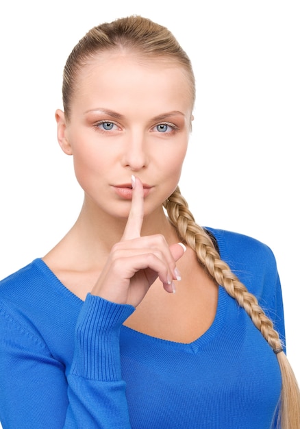 bright picture of teenage girl with finger on lips