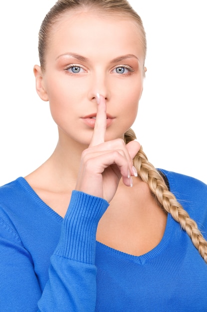 Photo bright picture of teenage girl with finger on lips