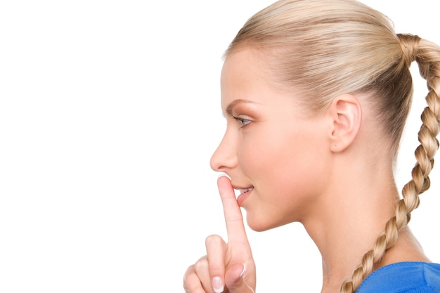 bright picture of teenage girl with finger on lips