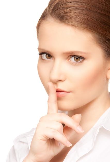 bright picture of teenage girl with finger on lips