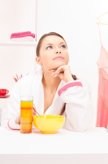 bright picture of woman eating her breakfast