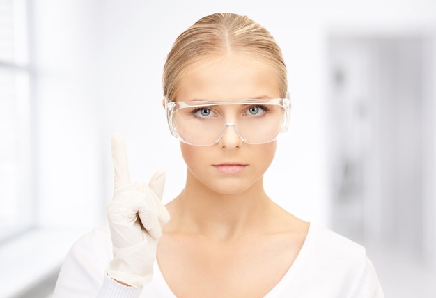 bright picture of woman in protective glasses and gloves