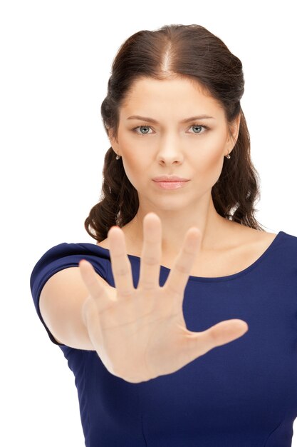 bright picture of young woman making stop gesture