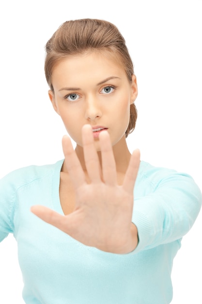 bright picture of young woman making stop gesture