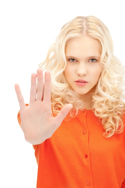 bright picture of young woman making stop gesture