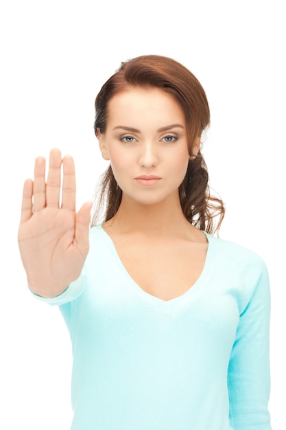 bright picture of young woman making stop gesture