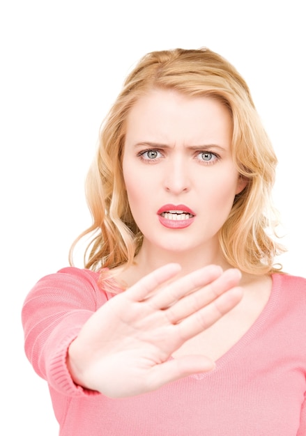 bright picture of young woman making stop gesture