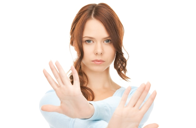 bright picture of young woman making stop gesture