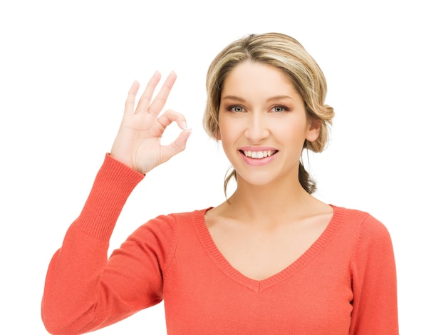 bright picture of young woman showing ok sign