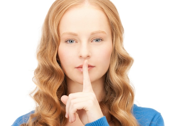 bright picture of young woman with finger on lips