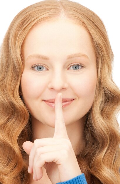 bright picture of young woman with finger on lips