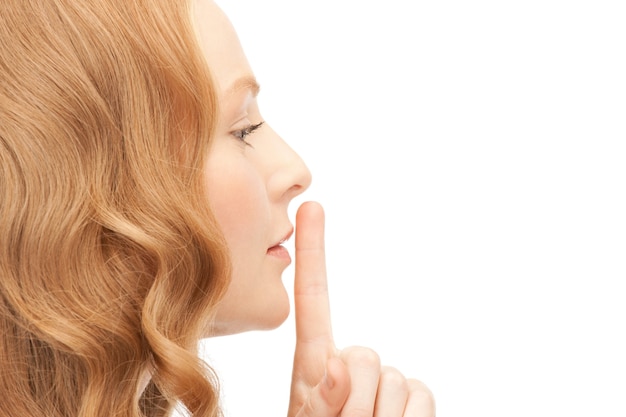 Photo bright picture of young woman with finger on lips