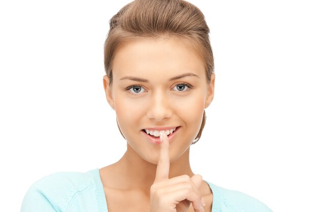 bright picture of young woman with finger on lips