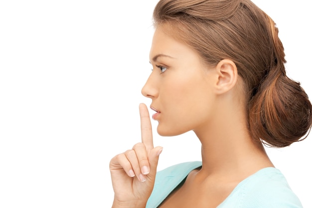 bright picture of young woman with finger on lips