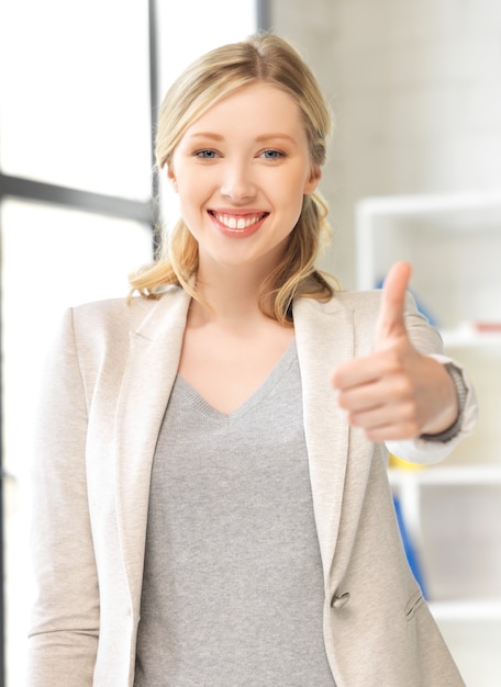 bright picture of young woman with thumbs up