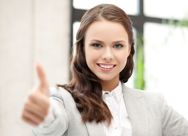 bright picture of young woman with thumbs up