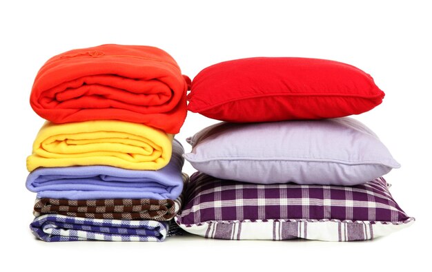 Bright pillows and plaids isolated on white