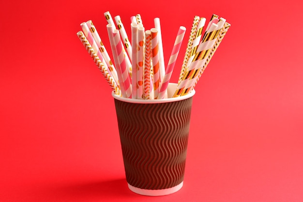 Bright pink and golden tubules in a paper cup