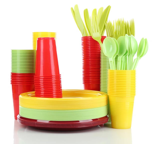 Premium Photo Bright plastic disposable tableware isolated on white