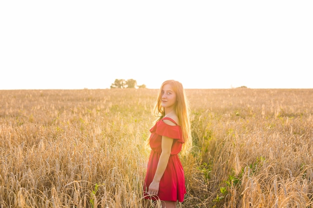 Bright Portrait of Happy Young Woman at Summer Field