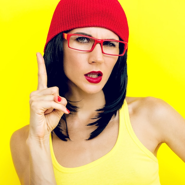 Bright portrait of stylish Girls on yellow background