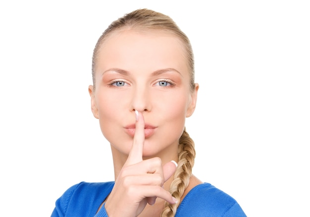 bright Portrait of teenage girl with finger on lips