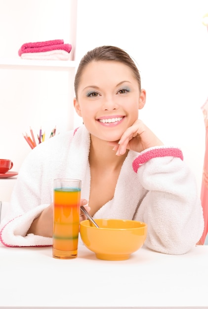 bright Portrait of woman eating her breakfast