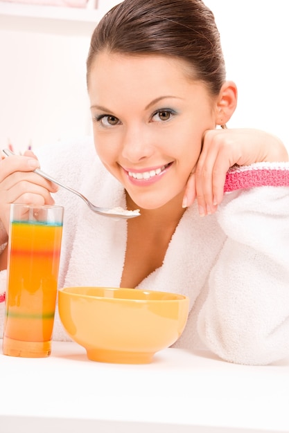 bright Portrait of woman eating her breakfast