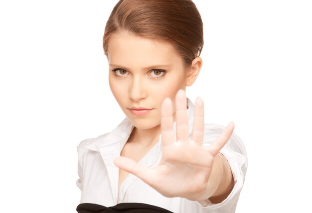 bright Portrait of young woman making stop gesture