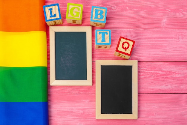 Bright rainbow gay flag on wooden background