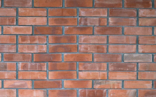 Bright red brick wall mansonry pattern