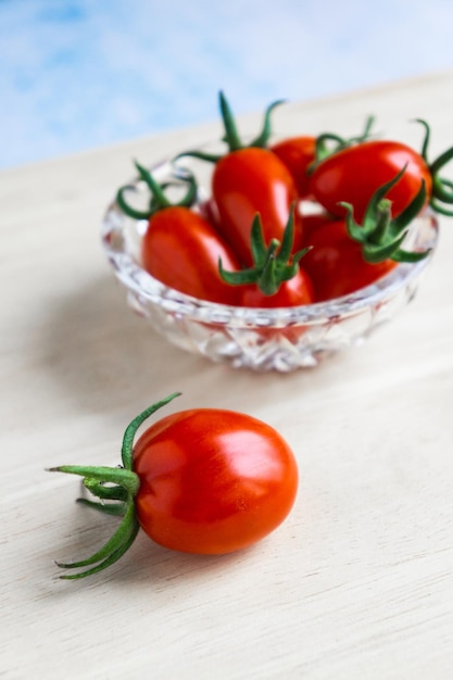 Bright red cherry tomatoes on the table