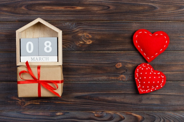 Bright red hearts with wooden block calendar and gift box