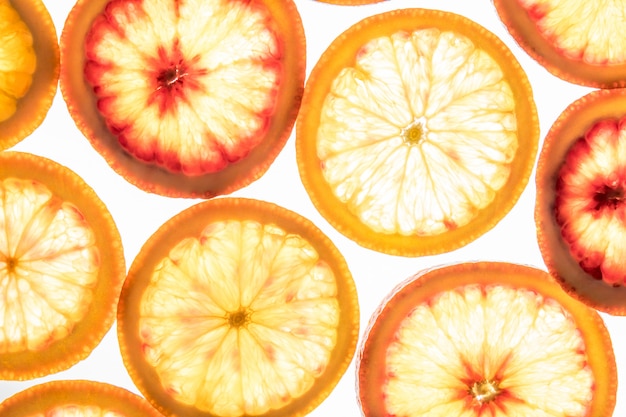 Bright red orange slices on white