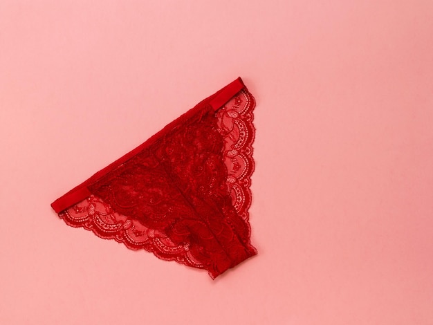 Bright red women's underwear on a red background Underwear The view from the top