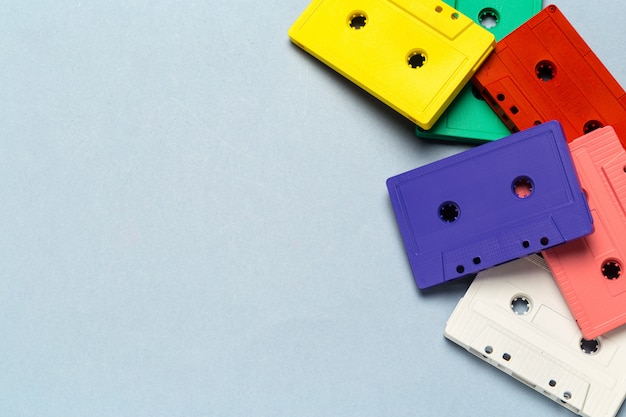 Bright retro cassette tapes on a light grey background