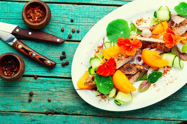 Bright salad with grilled meat steak