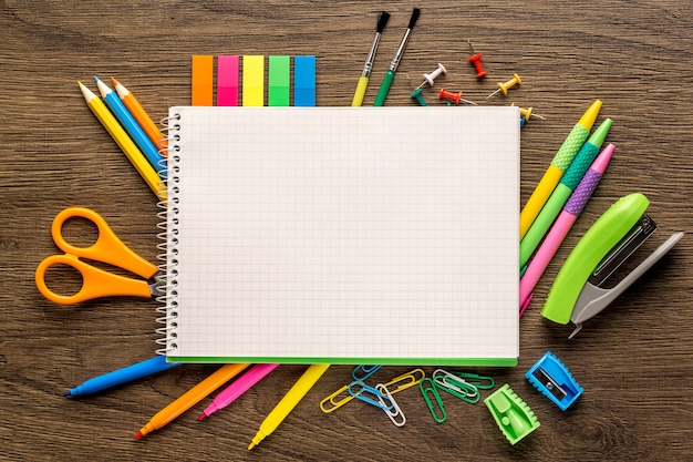 Bright school accessories, stationery on a wooden background