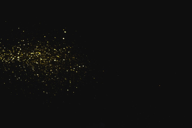 Foto paillettes luminose su sfondo scuro