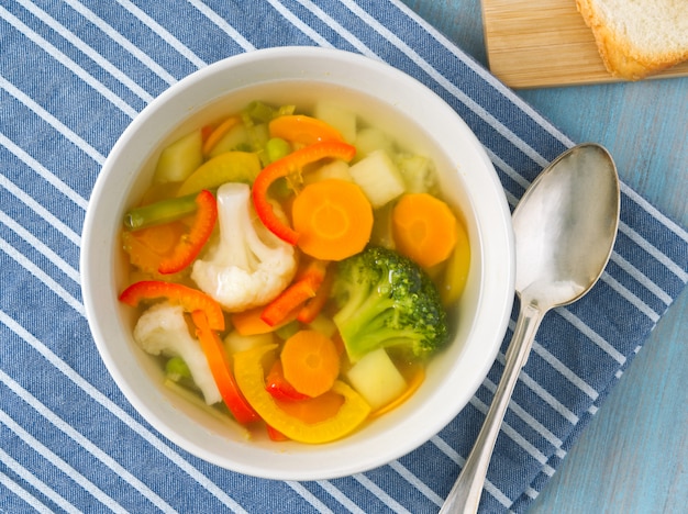 Bright spring vegetable dietary vegetarian soup with cauliflower, broccoli