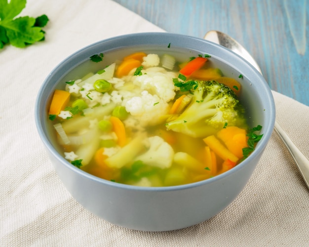 Bright spring vegetable dietary vegetarian soup with cauliflower