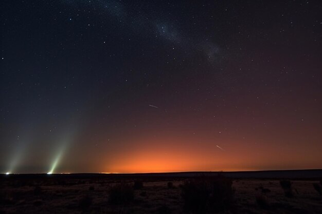A bright star is visible in the sky above a desert landscape.