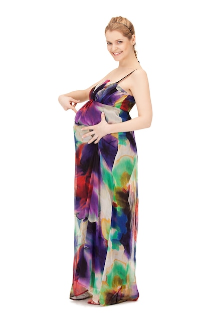 bright studio picture of beautiful pregnant woman