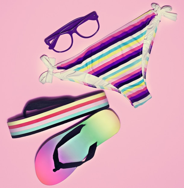 Bright summer beach look on pink background