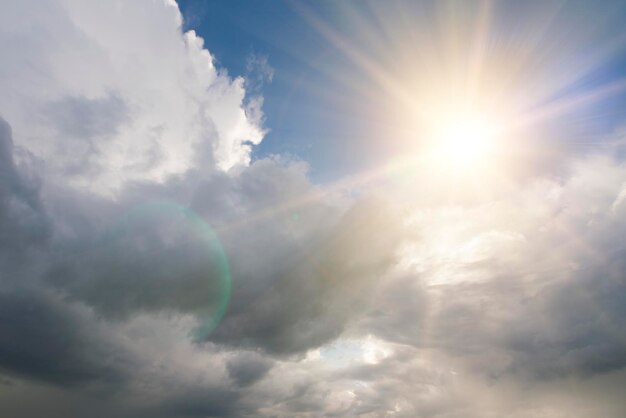 Bright sun over the clouds background