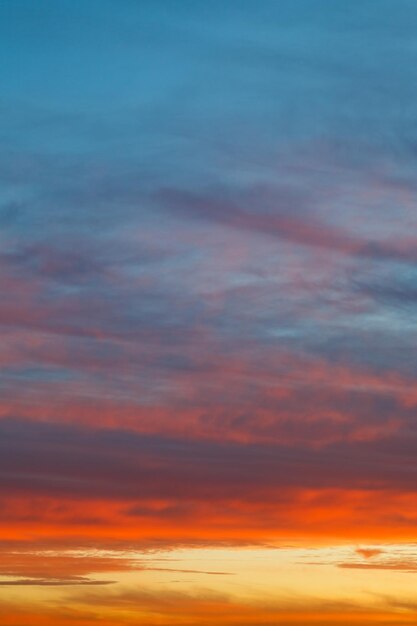 Bright sunrise clouds under blue morning sky