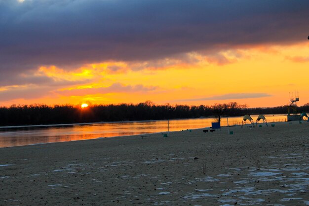 Bright sunset over the river Dnieper on winter