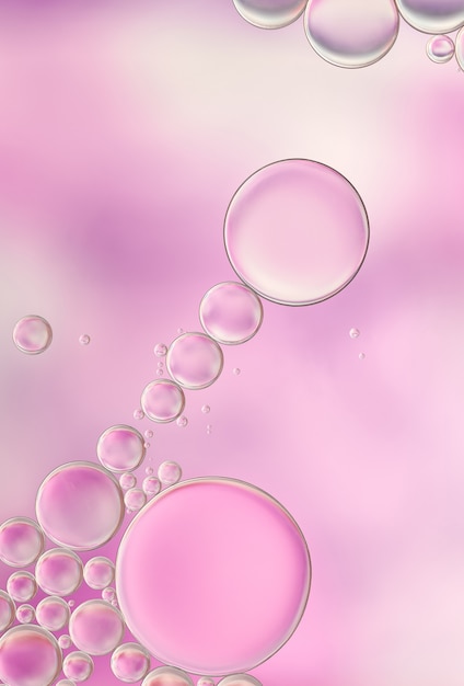 Bright and unique oil drops, circles on the water surface. Unusual background. Colorful wallpaper of  bublles