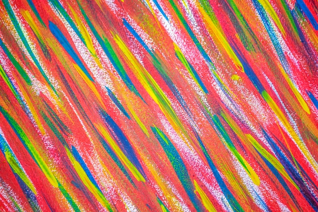 Bright variegated multicolored background of brush strokes with different paint closeup art and crea