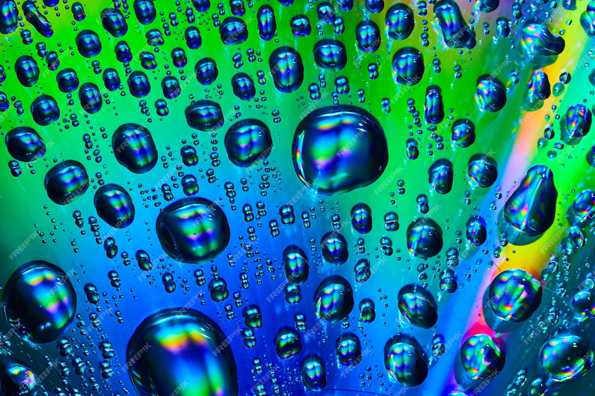 Premium Photo | Bright and vibrant water drops flowing across silvery ...